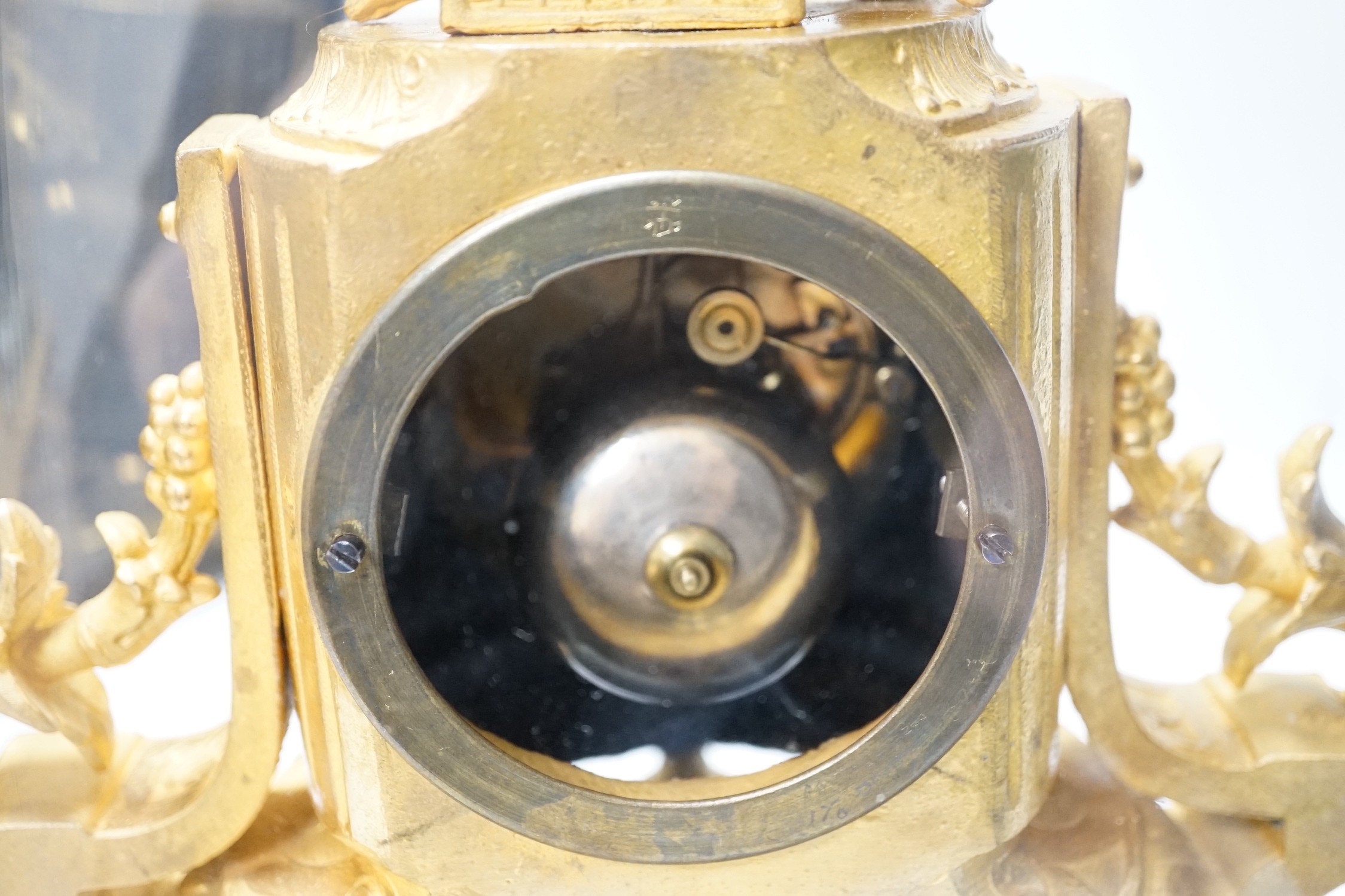 A French 19th century gilt metal clock by Phillipe H. Mourey on stand with glass dome, total height 49cm (dome a.f.)